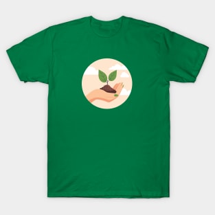 Female hand with sprout and soil T-Shirt